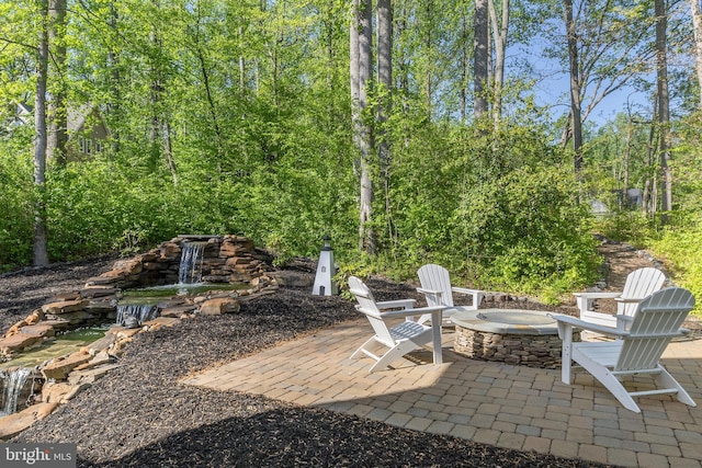 view of patio / terrace with a fire pit