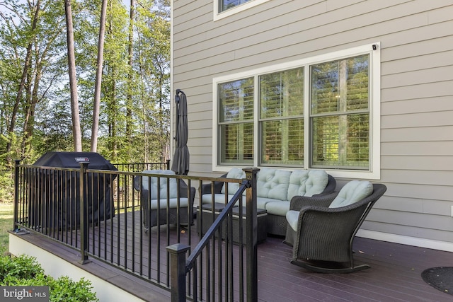 wooden terrace featuring an outdoor hangout area