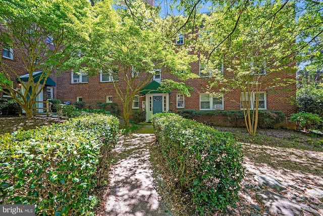 view of front of house featuring brick siding