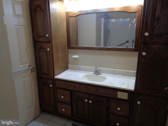 bathroom featuring tile patterned floors and vanity
