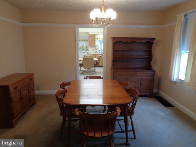 dining space with baseboards, visible vents, light carpet, and an inviting chandelier