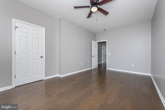 interior space with wood-type flooring, baseboards, and a ceiling fan
