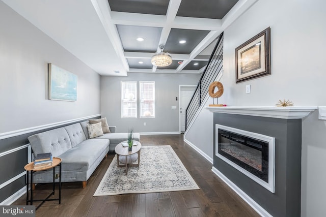 living room featuring recessed lighting, stairs, dark wood-type flooring, beamed ceiling, and coffered ceiling