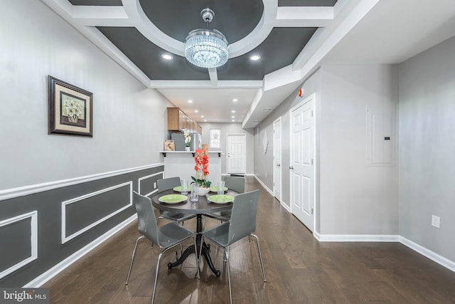 dining space with dark wood finished floors, recessed lighting, coffered ceiling, a notable chandelier, and beam ceiling