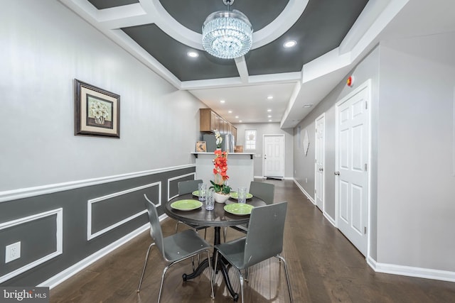 dining area featuring coffered ceiling, recessed lighting, a chandelier, and dark wood finished floors