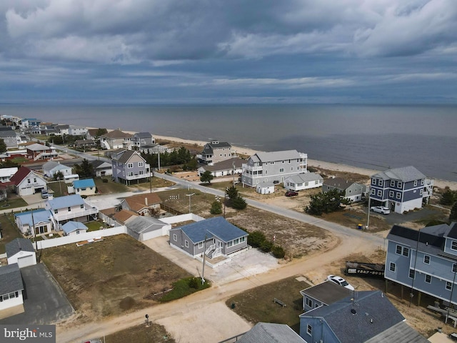 bird's eye view featuring a water view and a residential view