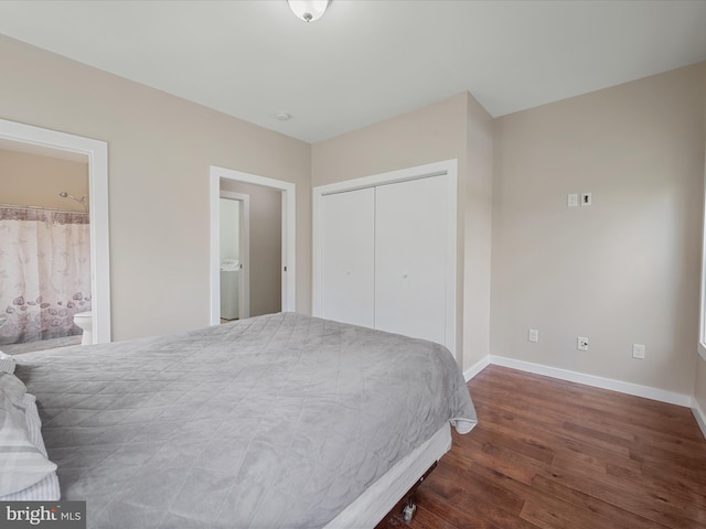 bedroom with baseboards, wood finished floors, ensuite bathroom, and a closet