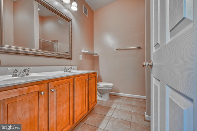 bathroom with baseboards, a sink, an enclosed shower, and toilet