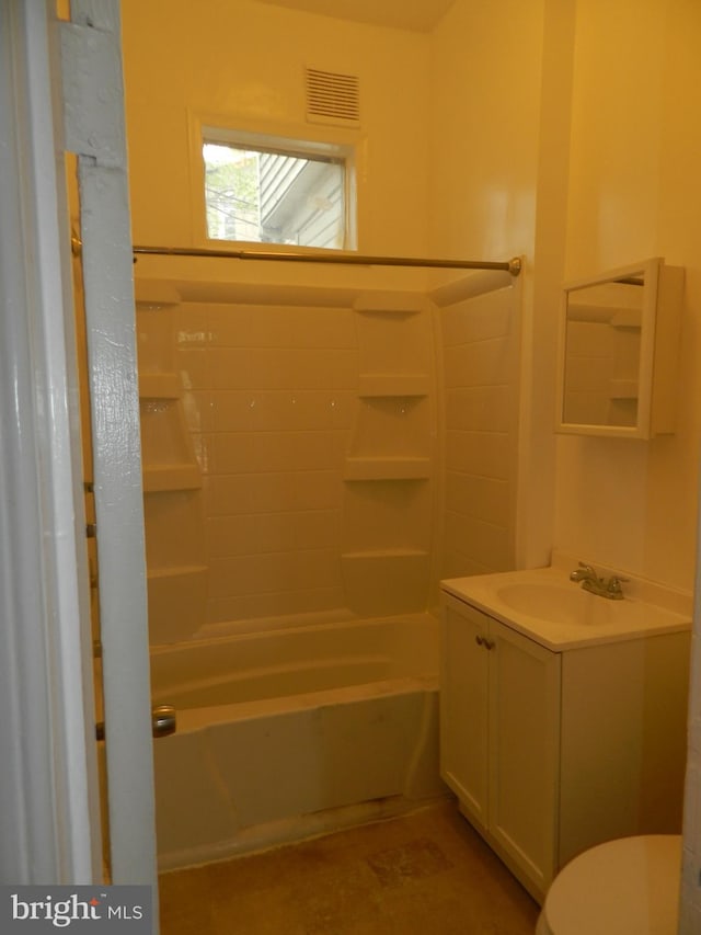 bathroom featuring toilet, vanity, and shower / bathing tub combination