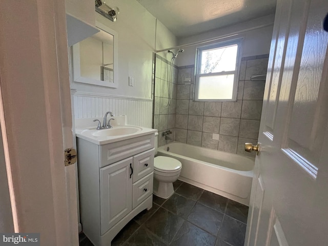 5714 63rd Ave, Riverdale, MD 20737 - full bath with bathing tub / shower combination, vanity, toilet, and a wainscoted wall