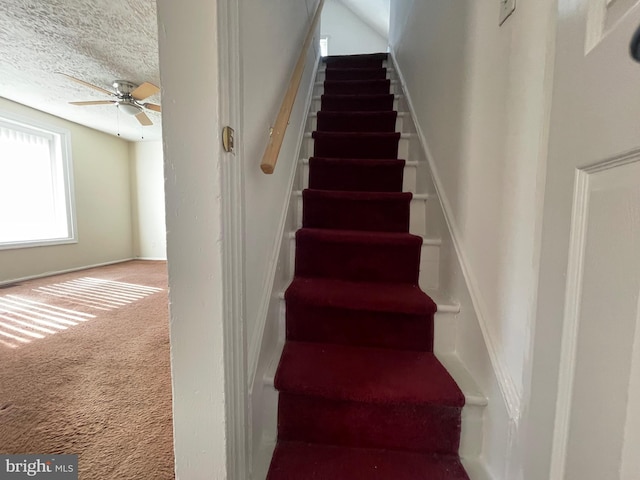 5714 63rd Ave, Riverdale, MD 20737 - staircase with carpet floors, ceiling fan, and a textured ceiling