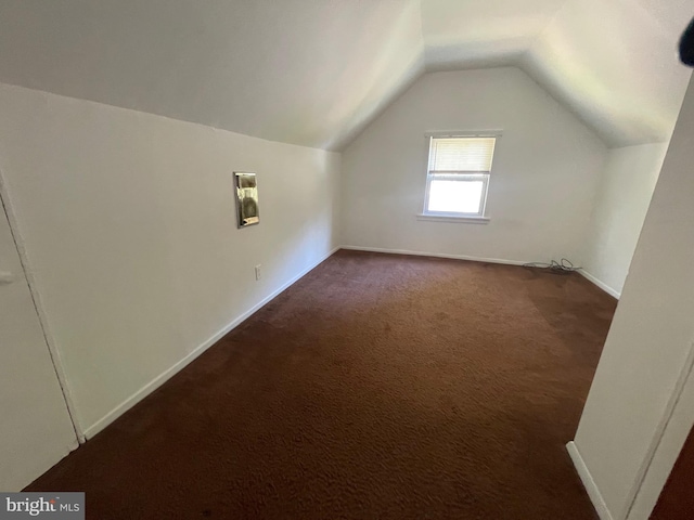 5714 63rd Ave, Riverdale, MD 20737 - bonus room featuring vaulted ceiling, dark colored carpet, and baseboards
