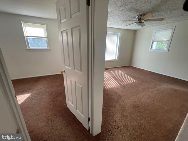 5714 63rd Ave, Riverdale, MD 20737 - unfurnished room featuring carpet floors, baseboards, ceiling fan, and a textured ceiling
