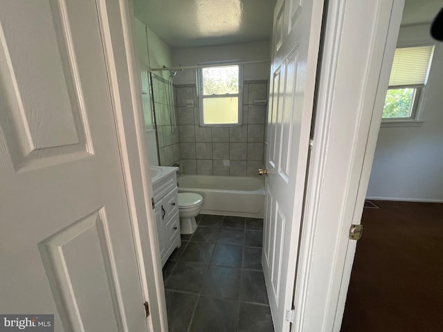 5714 63rd Ave, Riverdale, MD 20737 - full bath with vanity, healthy amount of natural light, toilet, and tile patterned flooring