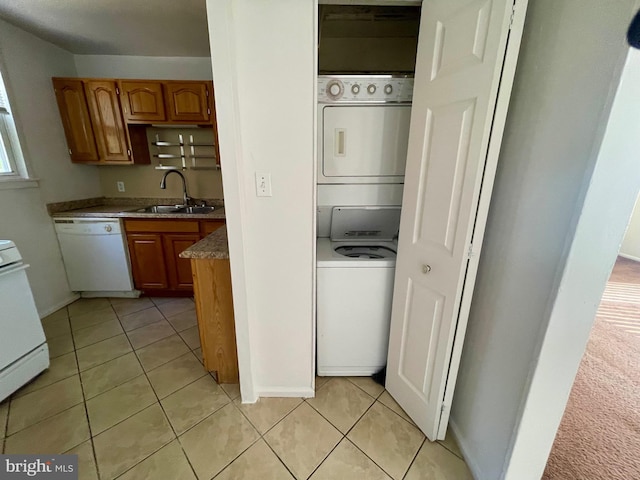5714 63rd Ave, Riverdale, MD 20737 - laundry area with estacked washer and dryer and light tile patterned floors