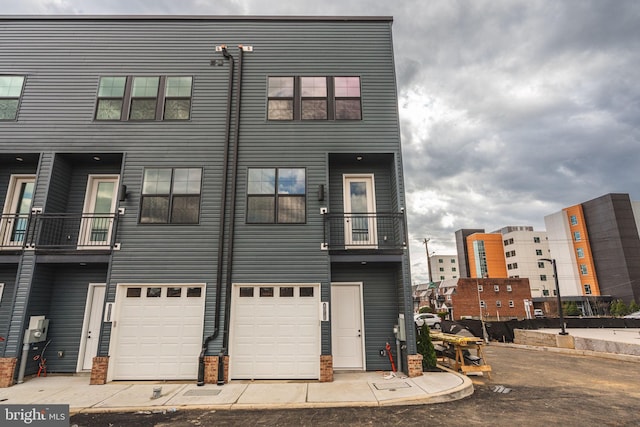 4030 Marilyn Dr, Philadelphia, PA 19131 - townhome / multi-family property with an attached garage, driveway, and a balcony