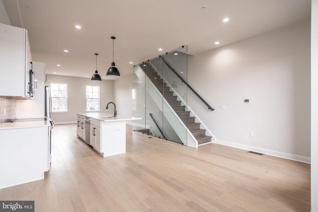 4030 Marilyn Dr, Philadelphia, PA 19131 - kitchen featuring visible vents, a sink, a kitchen island with sink, recessed lighting, and stainless steel appliances