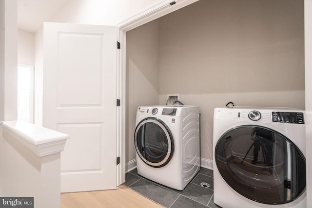 4030 Marilyn Dr, Philadelphia, PA 19131 - laundry room with tile patterned floors, washer and clothes dryer, laundry area, and baseboards