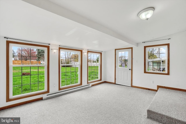 carpeted foyer entrance featuring plenty of natural light, baseboard heating, baseboards, and vaulted ceiling