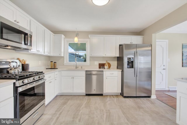 22 Spring Ridge Dr, York, PA 17408 - kitchen with white cabinets, light countertops, a sink, and appliances with stainless steel finishes