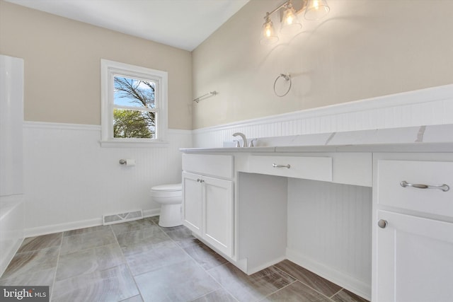 22 Spring Ridge Dr, York, PA 17408 - full bathroom featuring toilet, vanity, wainscoting, and visible vents