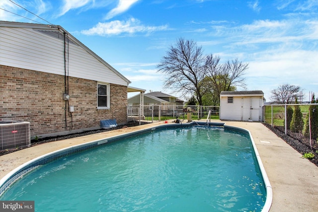 22 Spring Ridge Dr, York, PA 17408 - view of swimming pool featuring a storage shed, a fenced backyard, an outdoor structure, and central AC
