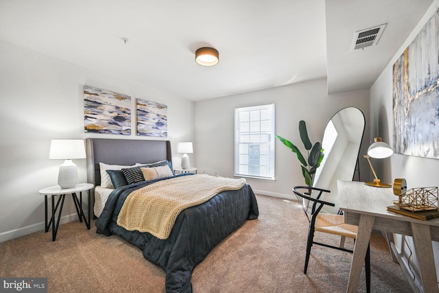 bedroom featuring visible vents, baseboards, and carpet floors