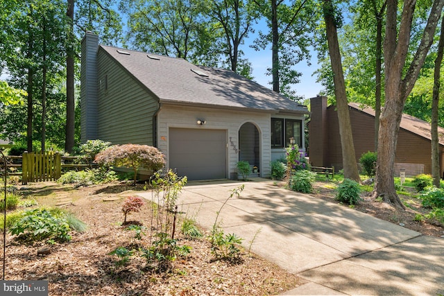 7536 Weather Worn Way, Columbia, MD 21046 - mid-century home featuring a garage, concrete driveway, a chimney, and a shingled roof