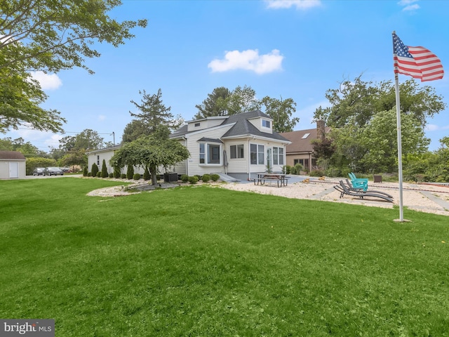 back of property with a yard, a patio, and cooling unit