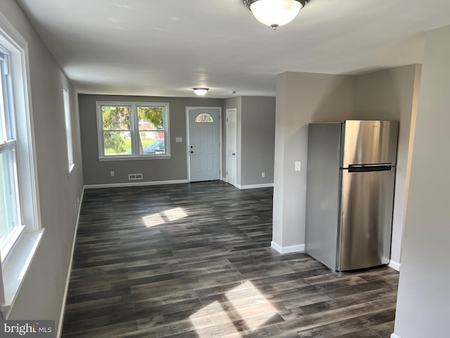 4301 Brehms Ln, Baltimore, MD 21206 - foyer entrance featuring dark wood-type flooring and baseboards