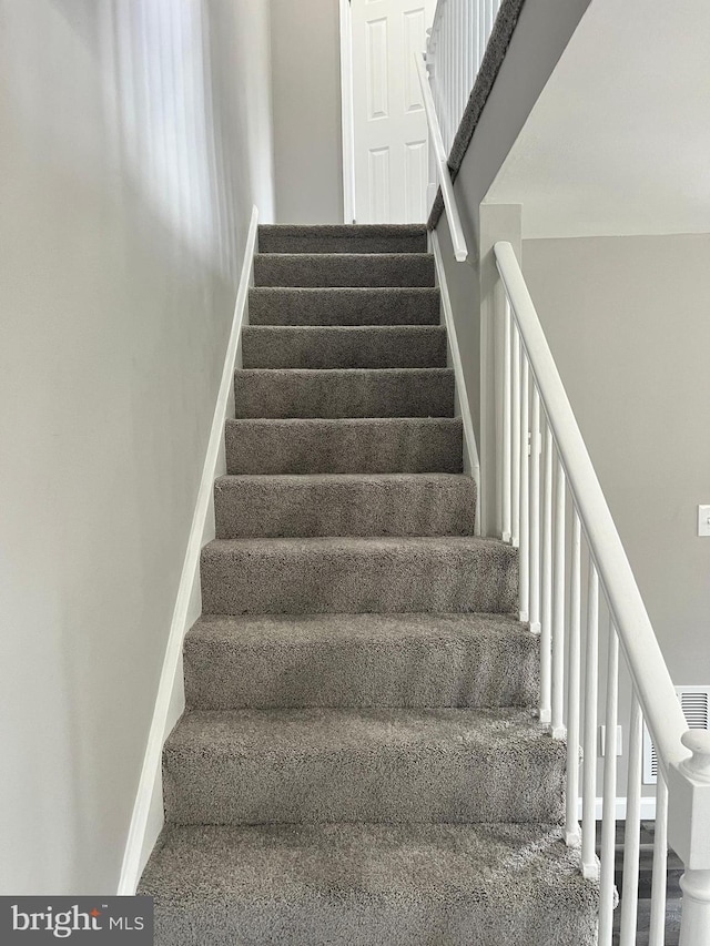 4301 Brehms Ln, Baltimore, MD 21206 - staircase with baseboards