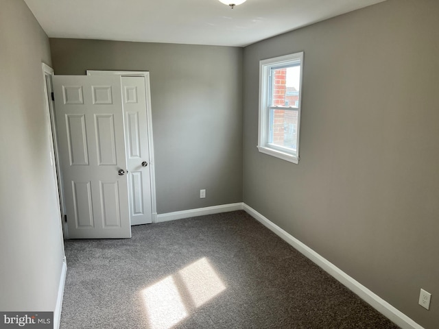4301 Brehms Ln, Baltimore, MD 21206 - carpeted spare room with baseboards