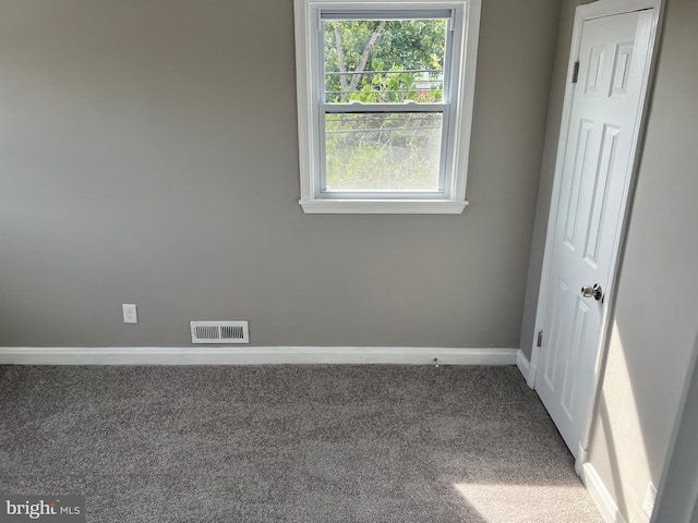 4301 Brehms Ln, Baltimore, MD 21206 - carpeted empty room featuring baseboards and healthy amount of natural light