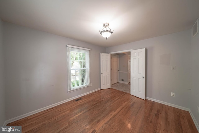 312 Fairgrove Ter, Gaithersburg, MD 20877 - unfurnished bedroom with baseboards and wood finished floors