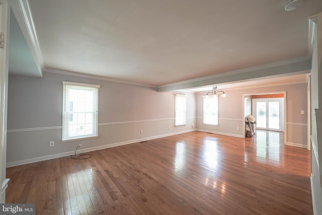 312 Fairgrove Ter, Gaithersburg, MD 20877 - spare room with plenty of natural light, ornamental molding, hardwood / wood-style flooring, and a smoke detector
