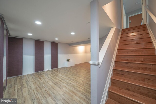 312 Fairgrove Ter, Gaithersburg, MD 20877 - stairs featuring wood finished floors, recessed lighting, and a wainscoted wall