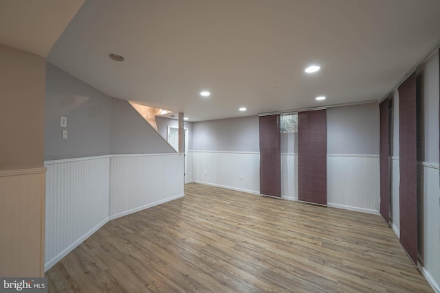 312 Fairgrove Ter, Gaithersburg, MD 20877 - finished below grade area with a wainscoted wall, wood finished floors, and recessed lighting