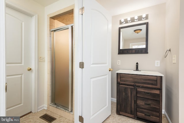 4808 Frazier Neck Rd, Preston, MD 21655 - bathroom featuring a shower stall, baseboards, vanity, and visible vents