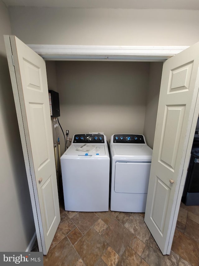 4808 Frazier Neck Rd, Preston, MD 21655 - washroom with washer and dryer, stone tile flooring, and laundry area