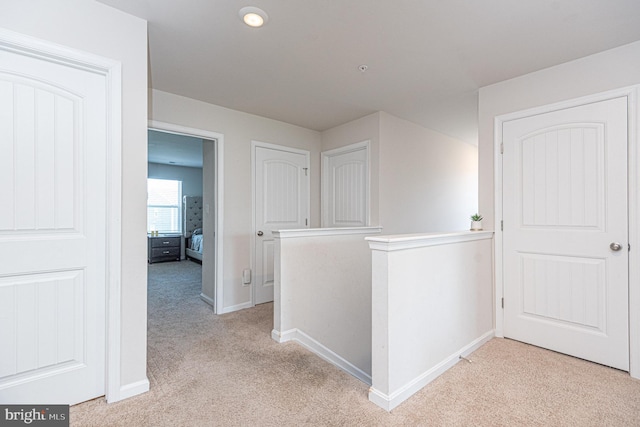 417 Lena Ln, Fruitland, MD 21826 - hall featuring light carpet, baseboards, and an upstairs landing