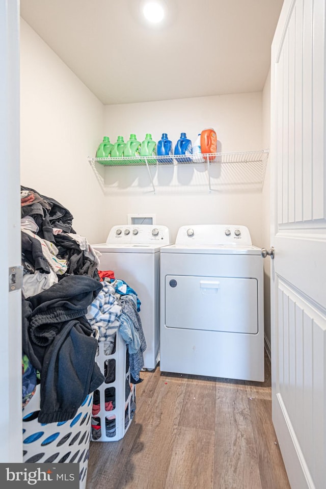 417 Lena Ln, Fruitland, MD 21826 - washroom featuring washing machine and dryer, wood finished floors, and laundry area