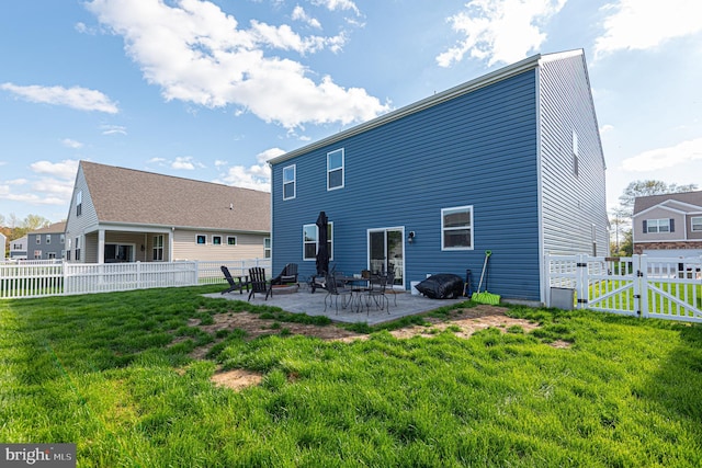 417 Lena Ln, Fruitland, MD 21826 - rear view of house featuring a gate, a patio, a fenced backyard, and a lawn