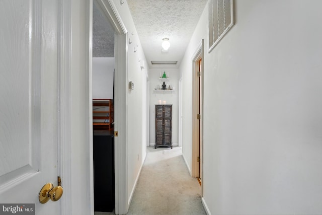 6775 Rugby Pl, Bealeton, VA 22712 - corridor with visible vents, a textured ceiling, baseboards, and light colored carpet