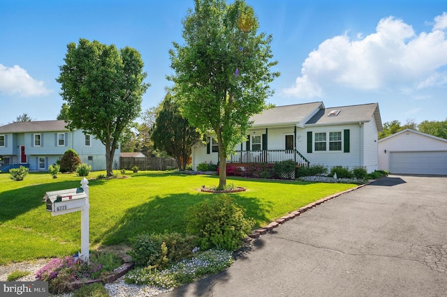 6775 Rugby Pl, Bealeton, VA 22712 - ranch-style home featuring a detached garage, an outdoor structure, covered porch, and a front yard