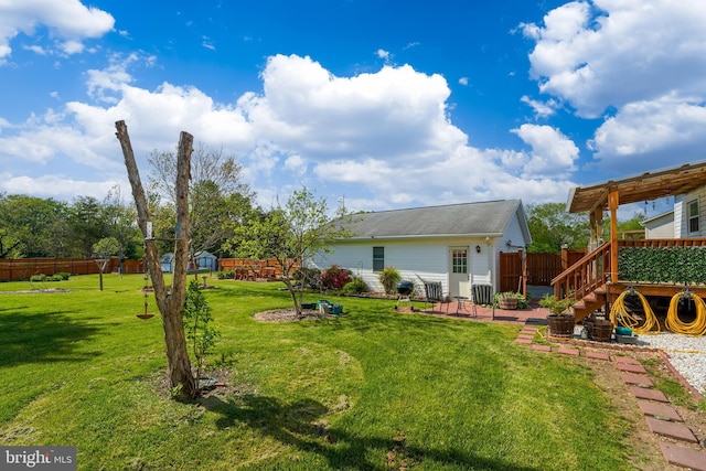 6775 Rugby Pl, Bealeton, VA 22712 - view of yard featuring a deck, fence, and a patio area