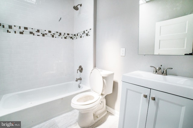 full bathroom with toilet, vanity, baseboards, and shower / bathtub combination