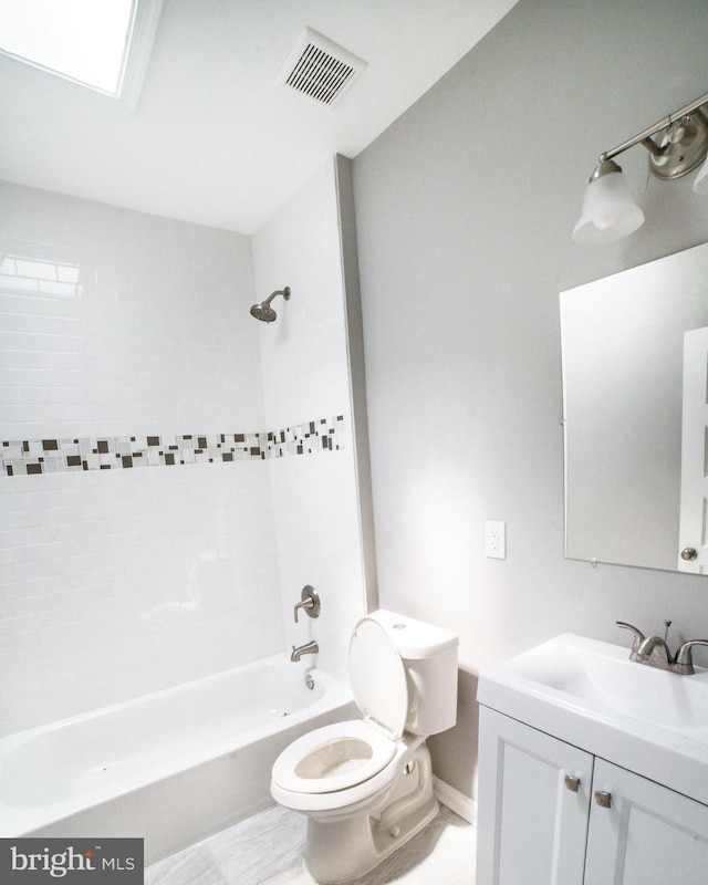full bathroom with visible vents, baseboards, toilet,  shower combination, and vanity