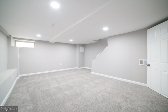 basement with visible vents, baseboards, recessed lighting, and carpet flooring