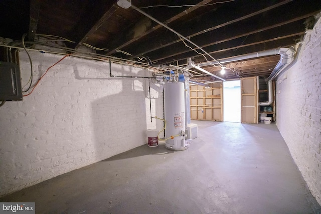below grade area with water heater and electric panel