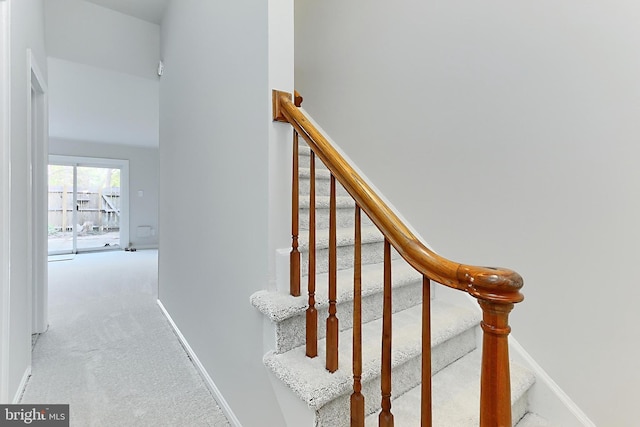 stairs with carpet flooring and baseboards